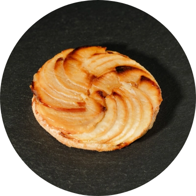 Golden delicious apples on puff pastry with almond cream filling.