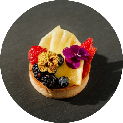 A mini tart from Preligen Artisan Bakery, made of fresh mix berries with vanilla pastry cream.